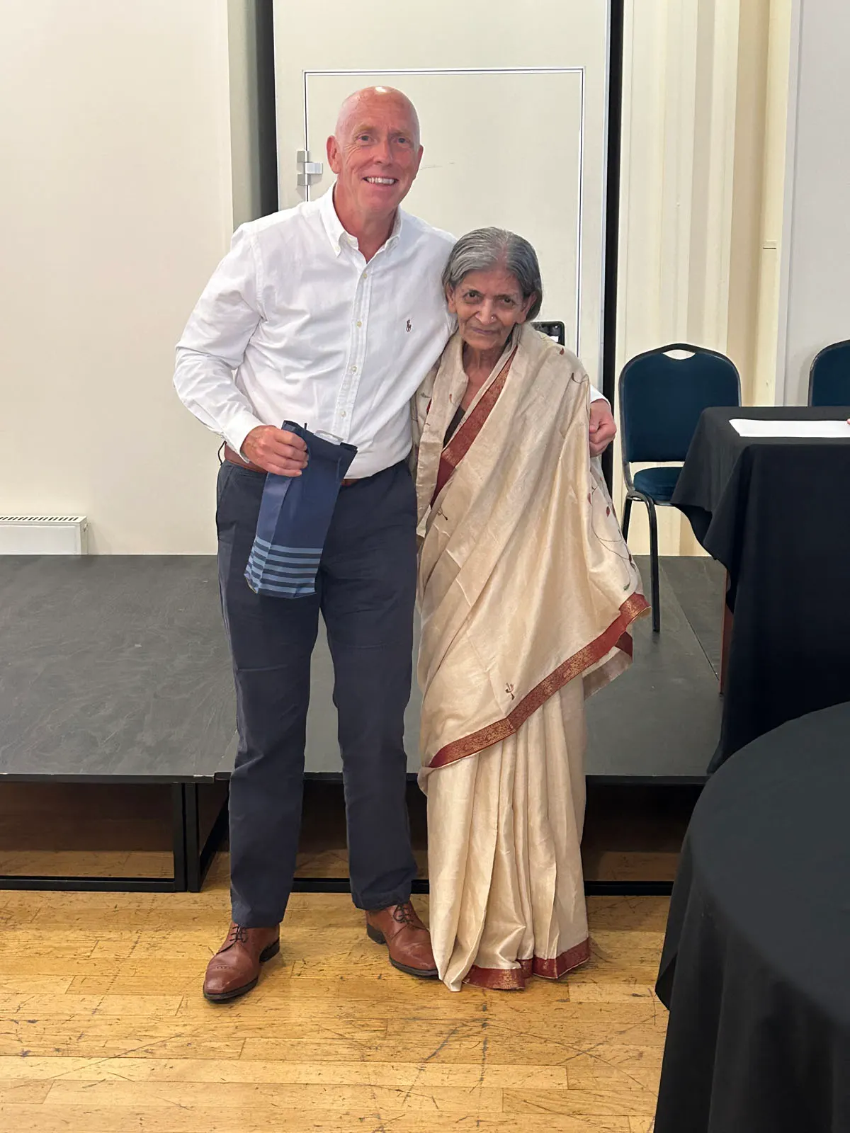 CEO Mr Tony Gamby receiving Business Card Lucky Draw Prize from CEO24X7 Founder Pravina Pathak